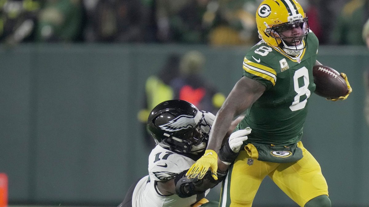 Green Bay Packers running back Josh Jacobs (8) makes a reception for a first down before ebbing tackled by Philadelphia Eagles linebacker Nakobe Dean (17) during the first quarter of their game Monday, November 10, 2025 at Lambeau Field in Green Bay, Wisconsin.