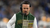 Green Bay Packers head coach Matt LaFleur calls a play against the Detroit Lions during the first quarter at Ford Field.