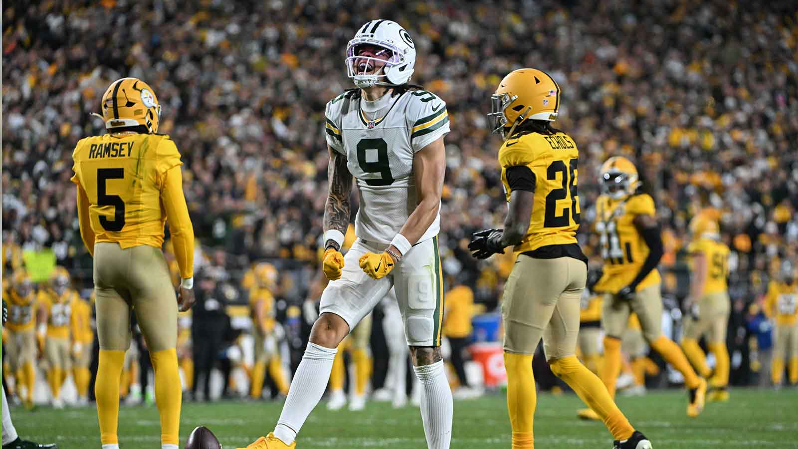 Green Bay Packers wide receiver Christian Watson (9) reacts following a catch against the Pittsburgh Steelers during the second half at Acrisure Stadium