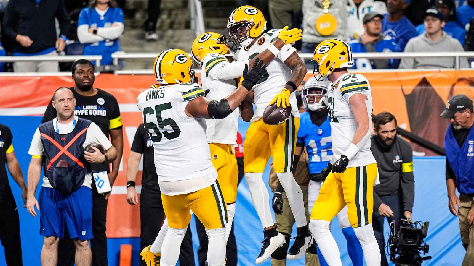 Green Bay Packers wide receiver Dontayvion Wicks (13) celebrates a touchdown against Green Bay Packers during the first half at Ford Field in Detroit on Thursday, Nov. 27, 2025.