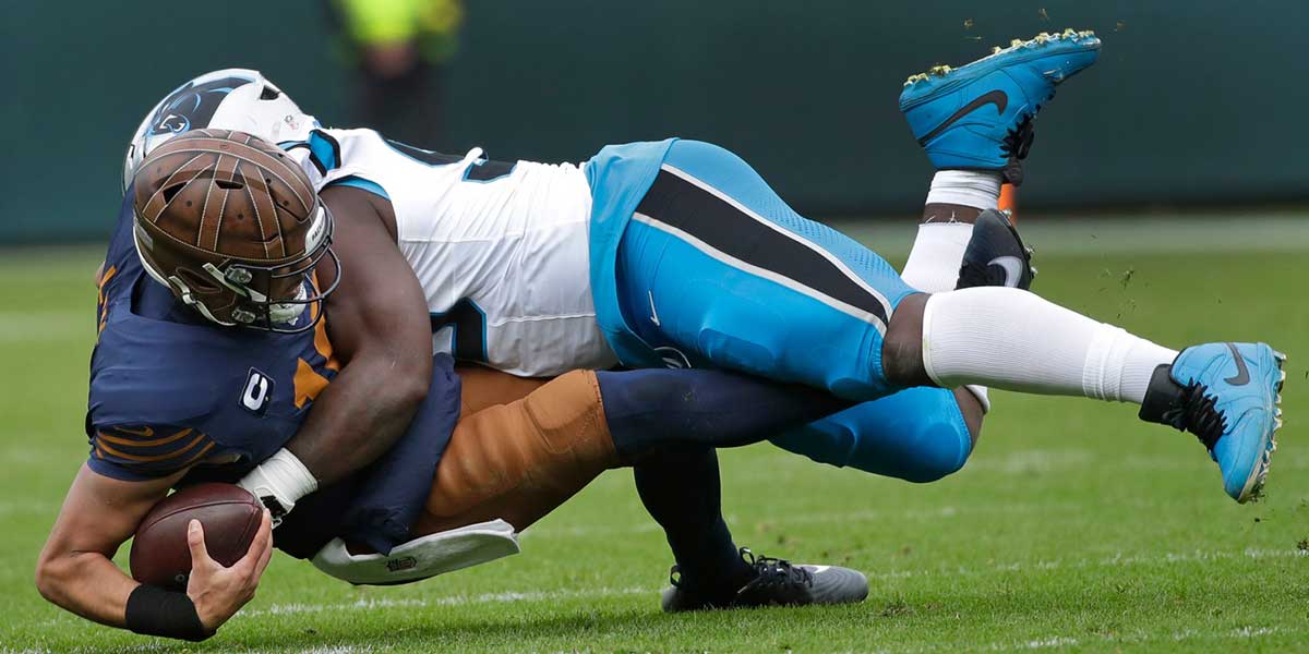 Green Bay Packers quarterback Jordan Love (10) is sacked by Carolina Panthers defensive tackle Tershawn Wharton (99) during their football game Sunday, November 2, 2025, at Lambeau Field in Green Bay, Wisconsin.