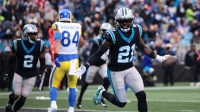 Carolina Panthers safety Nick Scott (21) celebrates after Carolina Panthers cornerback Mike Jackson (2) intercepts a pass to score a touchdown during the first quarter against the Los Angeles Rams at Bank of America Stadium.