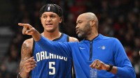 Orlando Magic head coach Jamahl Mosley speaks to forward Paolo Banchero (5) in the first half against the Toronto Raptors at Scotiabank Arena.