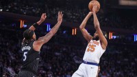 New York Knicks guard Mikal Bridges (25) takes a jump shot past Orlando Magic forward Paolo Banchero (5) in the first quarter at Madison Square Garden.