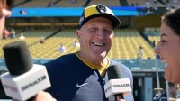 Milwaukee Brewers manager Pat Murphy (49) speaks to media on the field before game three against the Los Angeles Dodgers in the NLCS round for the 2025 MLB playoffs at Dodger Stadium.