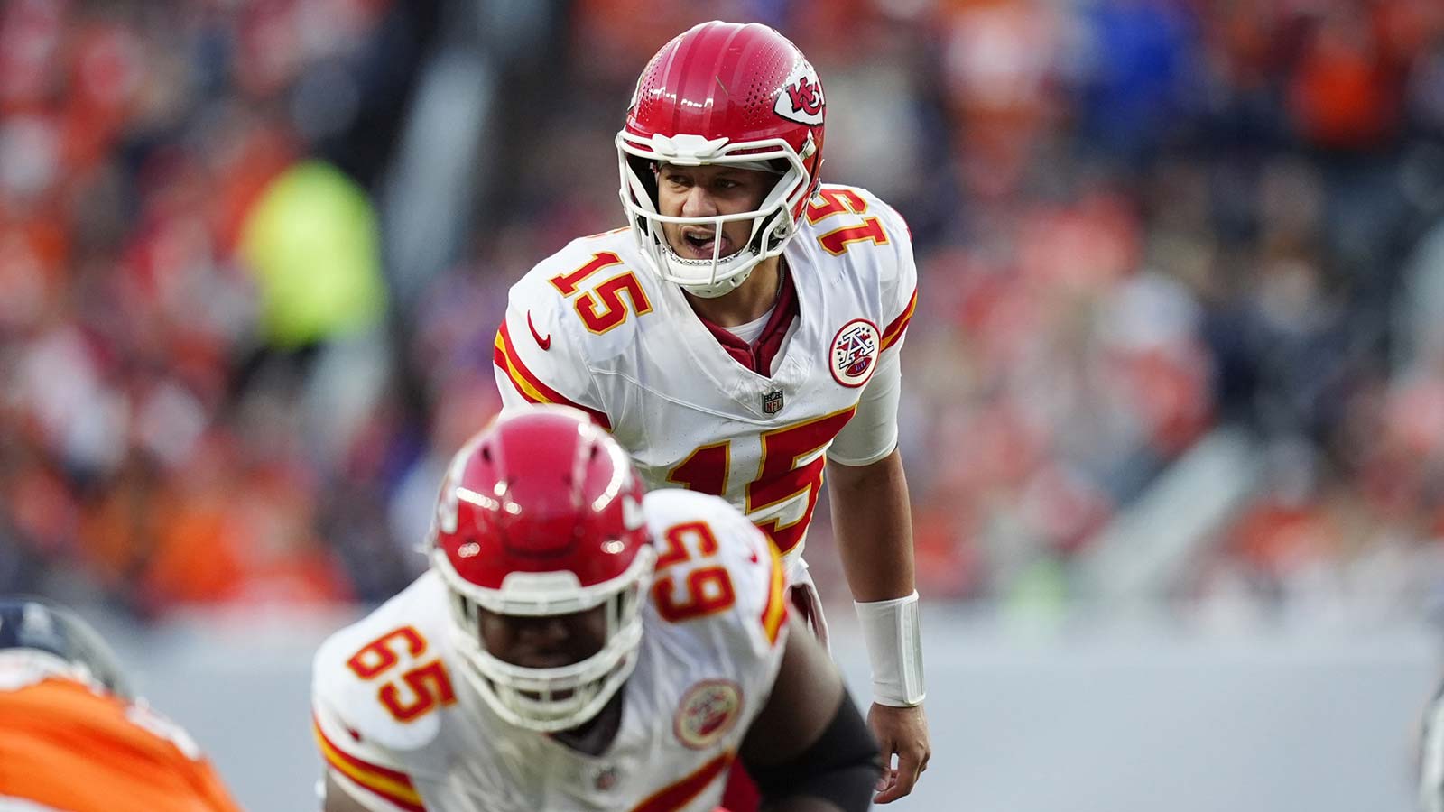 Kansas City Chiefs quarterback Patrick Mahomes (15) calls out from the line of scrimmage in the third quarter against the Denver Broncos at Empower Field at Mile High.
