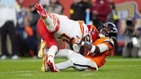Denver Broncos cornerback Ja'Quan McMillian (29) sacks Kansas City Chiefs quarterback Patrick Mahomes (15) in the fourth quarter at Empower Field at Mile High.