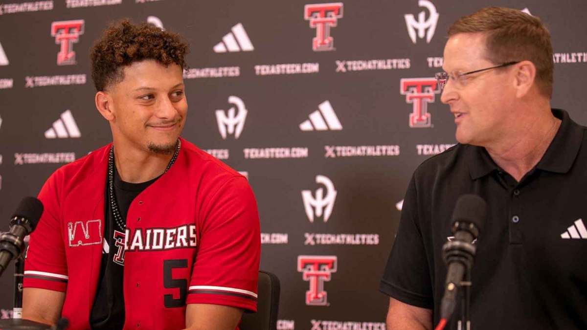 Patrick Mahomes looks at Texas Tech director of athletics Kirby Hocutt during a press conference at Jones AT&T Stadium