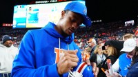 Denver Broncos cornerback Pat Surtain II (2) signs autographs before the game at Empower Field at Mile High.