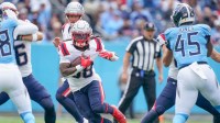 New England Patriots running back Rhamondre Stevenson (38) runs the ball against the Tennessee Titans during the first quarter at Nissan Stadium in Nashville, Tenn., Sunday, Oct. 19, 2025.