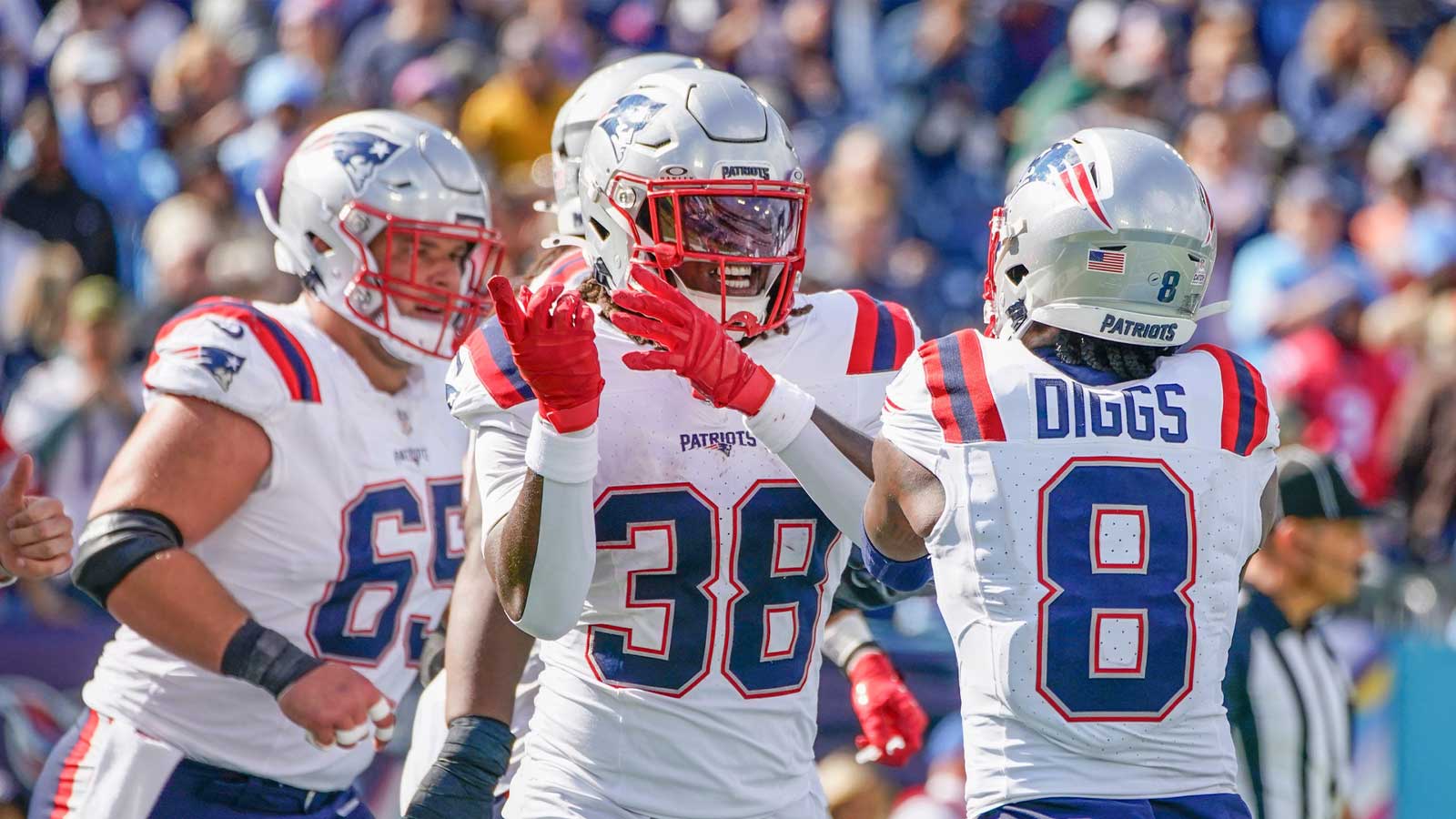 New England Patriots running back Rhamondre Stevenson (38) celebrates his touchdown against the Tennessee Titans during the third quarter at Nissan Stadium.