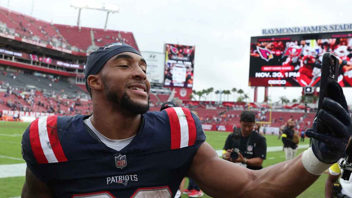 New England Patriots running back Treveyon Henderson (32) walks off field following a game against the Tampa Bay Buccaneers at Raymond James Stadium.
