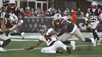 Atlanta Falcons quarterback Michael Penix Jr. (9) runs the ball against New England Patriots defensive end Milton Williams (97) during the first half at Gillette Stadium.