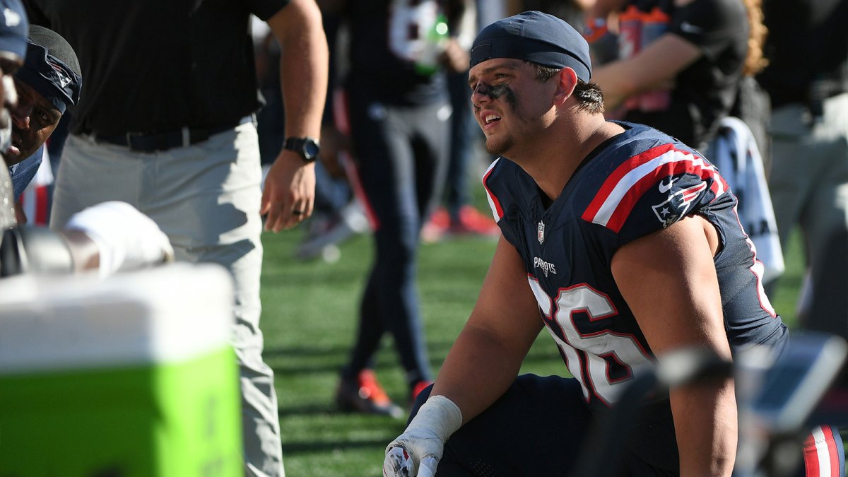 New England Patriots offensive tackle Will Campbell (66) talks to a teammate during the second half against the Carolina Panthers at Gillette Stadium.