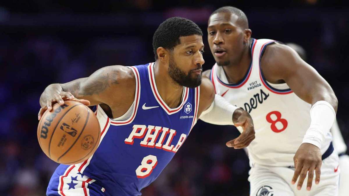 Philadelphia 76ers forward Paul George (8) drives against LA Clippers guard Kris Dunn (8) during the first quarter at Xfinity Mobile Arena.