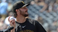 Pittsburgh Pirates pitcher Paul Skenes (30) tosses a ball to fans before the game against the Athletics at PNC Park.
