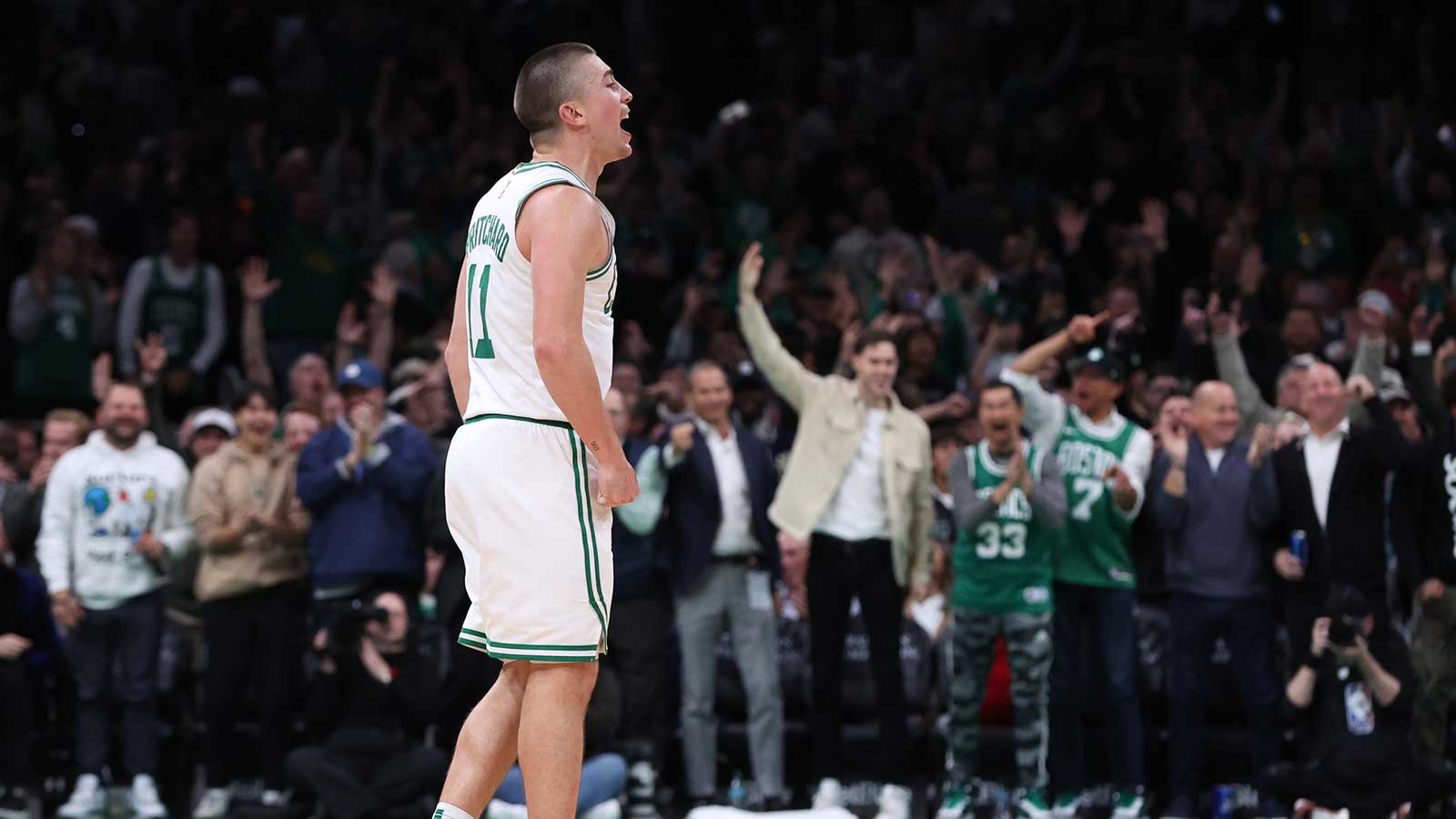 Boston Celtics guard Payton Pritchard (11) reacts after a shot during the second half against the Milwaukee Bucks at TD Garden.