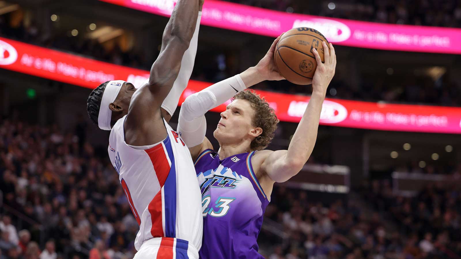 Utah Jazz forward Lauri Markkanen (23) looks past Detroit Pistons center Jalen Duren (0) and to the basket during the second half at Vivint Arena.