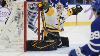 Pittsburgh Penguins goaltender Tristan Jarry (35) makes a save on Toronto Maple Leafs forward Nic Robertson (89) during the first period at Scotiabank Arena.