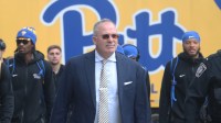 Pittsburgh Panthers head coach Pat Narduzzi (middle) leads the Panthers to the stadium to play the North Carolina State Wolfpack at Acrisure Stadium.