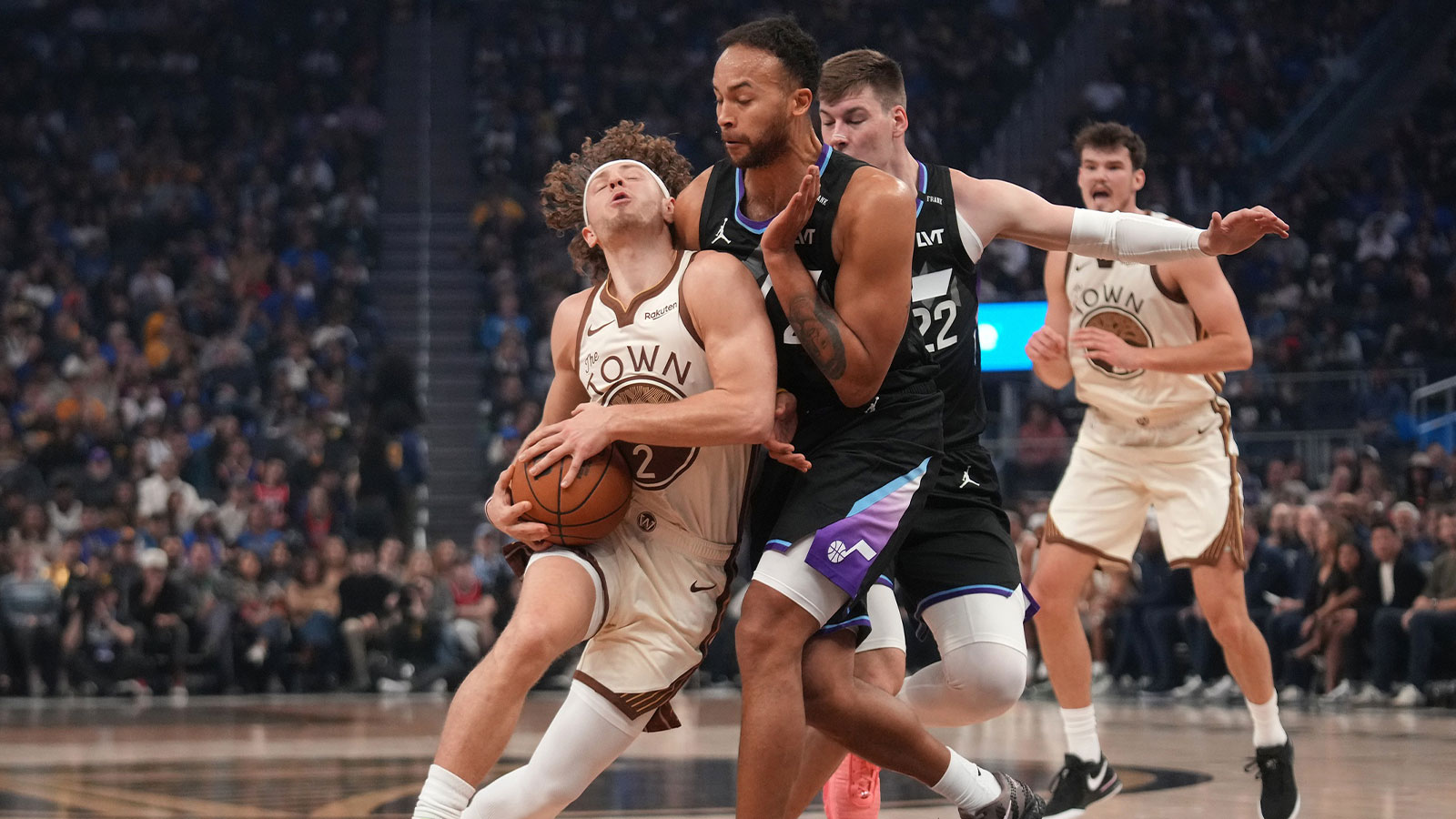Golden State Warriors guard Brandin Podziemski (2) is fouled by Utah Jazz forward Kyle Anderson (2) in the first quarter at the Chase Center. 