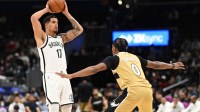 Brooklyn Nets forward Michael Porter Jr. (17) looks to pass over Washington Wizards guard Bilal Coulibaly (0) during the first quarter at Capital One Arena.