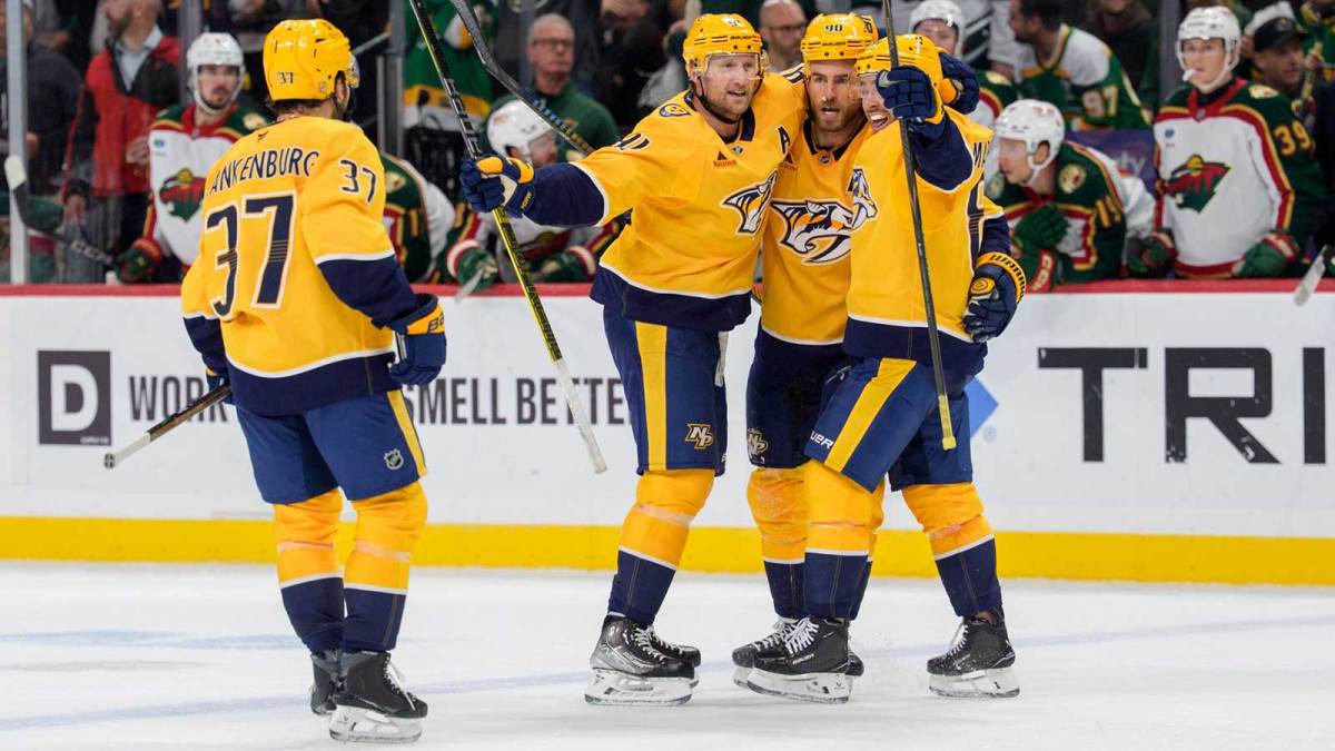 Nashville Predators center Steven Stamkos (91) celebrates with teammates after scoring on the Minnesota Wild with just 0.3 seconds left in the third period at Grand Casino Arena.