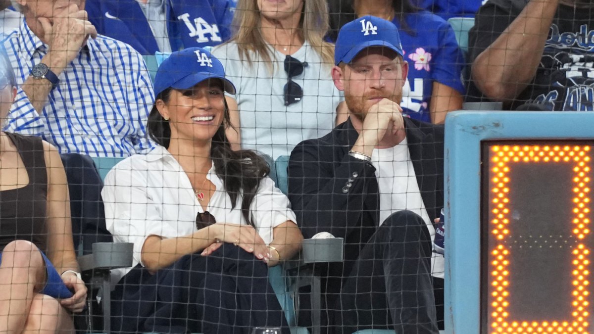 Prince Harry (right) and Meghan Markle (left) look on in the third inning between the Toronto Blue Jays and the Los Angeles Dodgers during game four of the 2025 MLB World Series at Dodger Stadium.