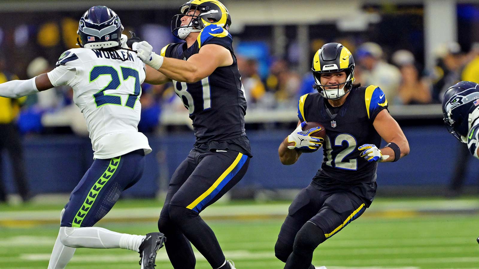 Los Angeles Rams wide receiver Puka Nacua (12) runs the ball during the second half against the Seattle Seahawks at SoFi Stadium.
