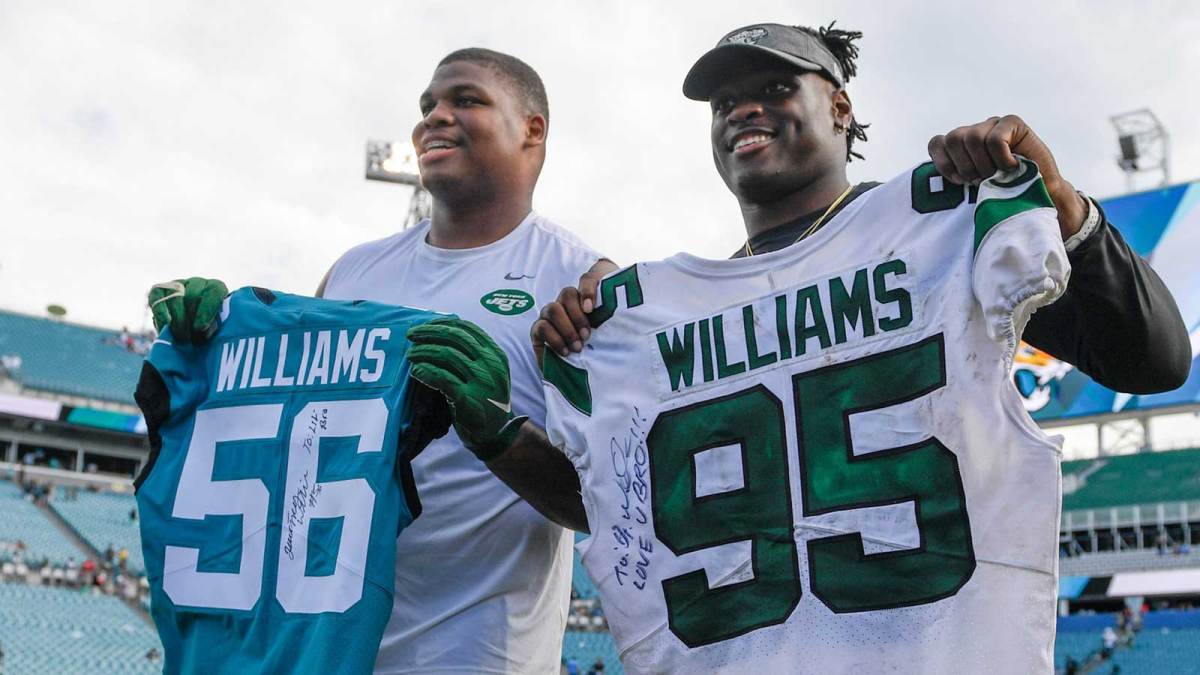 New York Jets defensive tackle Quinnen Williams (95) and Jacksonville Jaguars linebacker Quincy Williams (56) exchange jerseys after the game between the Jacksonville Jaguars and the New York Jets at TIAA Bank Field.