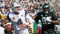 Dallas Cowboys quarterback Dak Prescott (4) looks to pass downfield as New York Jets defensive tackle Quinnen Williams (95) defends during the first half at MetLife Stadium.