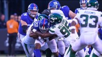 New York Jets defensive tackle Quinnen Williams (95) tackles New York Giants running back Wayne Gallman (22) during the first quarter at MetLife Stadium.