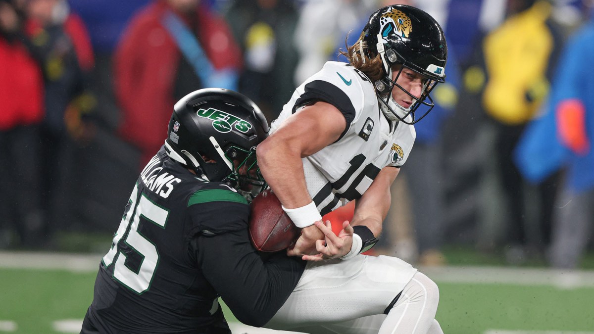 Jacksonville Jaguars quarterback Trevor Lawrence (16) is sacked by New York Jets defensive tackle Quinnen Williams (95) forcing a fumble during the first half at MetLife Stadium.