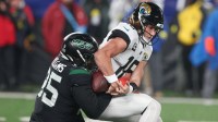 Jacksonville Jaguars quarterback Trevor Lawrence (16) is sacked by New York Jets defensive tackle Quinnen Williams (95) forcing a fumble during the first half at MetLife Stadium.