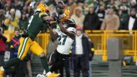 Green Bay Packers wide receiver Christian Watson (9) is defended by Philadelphia Eagles cornerback Quinyon Mitchell (27) n the first half at Lambeau Field.