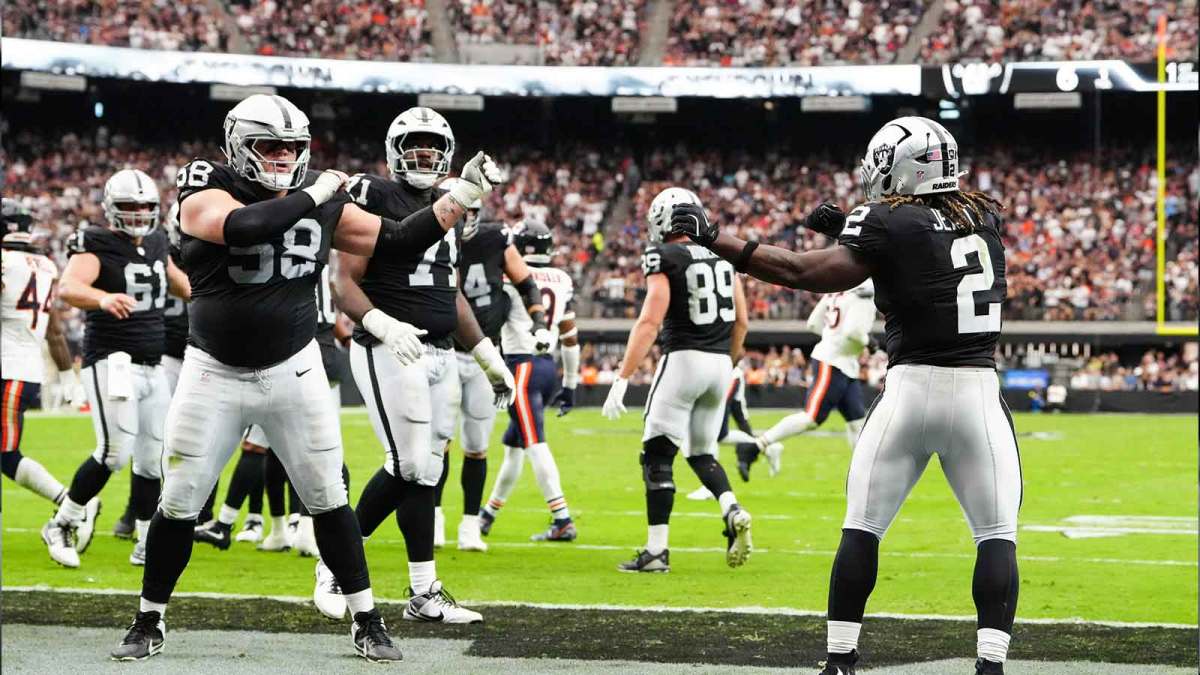 Las Vegas Raiders running back Ashton Jeanty (2) celebrates a touchdown with center Jackson Powers-Johnson (58) during the first quarter against the Chicago Bears at Allegiant Stadium.