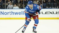 New York Rangers center Jonny Brodzinski (22) controls the puck in the third period against the New York Islanders at Madison Square Garden