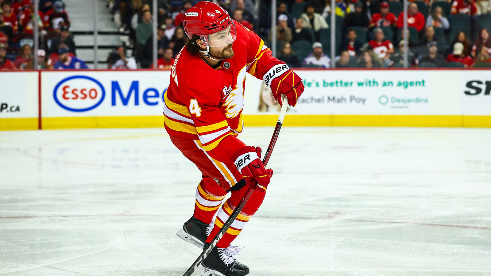 Calgary Flames defenseman Rasmus Andersson (4) shoots the puck against the New York Rangers during the first period at Scotiabank Saddledome