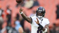 Baltimore Ravens quarterback Lamar Jackson (8) warms up before a game against the Cleveland Browns at Huntington Bank Field.