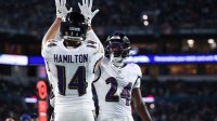 Baltimore Ravens safety Kyle Hamilton (14) and safety Malaki Starks (24) react after a play during the second quarter against the Miami Dolphins at Hard Rock Stadium