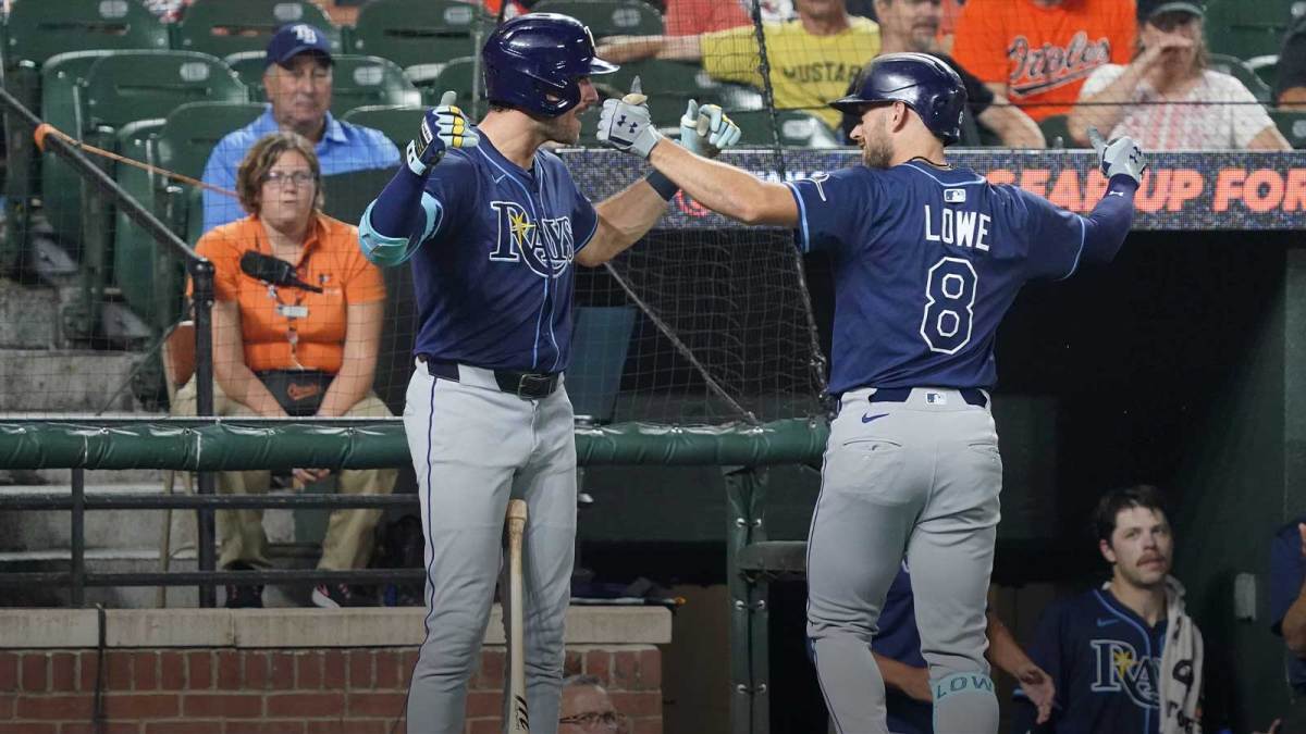 Tampa Bay Rays designated hitter Brandon Lowe (8) greeted by outfielder Josh Lowe (15) following his solo home run during the third inning against the Baltimore Orioles at Oriole Park at Camden Yards.