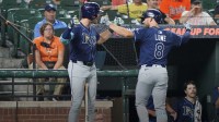 Tampa Bay Rays designated hitter Brandon Lowe (8) greeted by outfielder Josh Lowe (15) following his solo home run during the third inning against the Baltimore Orioles at Oriole Park at Camden Yards.