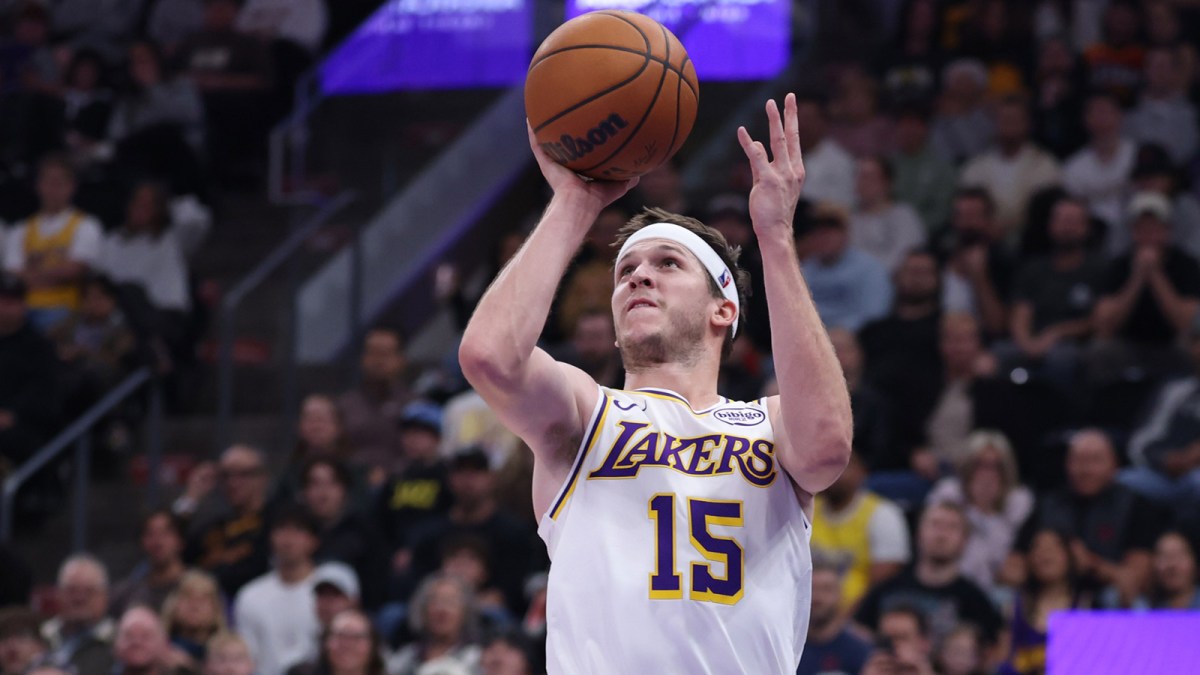 Los Angeles Lakers guard Austin Reaves (15) takes a shot at the buzzer against the Utah Jazz to end the first half at Delta Center.