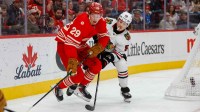 Detroit Red Wings center Nate Danielson (29) fights for control of the puck with Chicago Blackhawks defenseman Artyom Levshunov (55) during the first period at Little Caesars Arena.