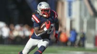 New England Patriots running back Rhamondre Stevenson (38) runs with the ball during the third quarter against the Cleveland Browns at Gillette Stadium.
