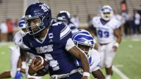 Oct 31, 2025; Houston, Texas, USA; Rice Owls quarterback Chase Jenkins (4) rushes against the Memphis Tigers in the second half at Rice Stadium. Mandatory Credit: Thomas Shea-Imagn Images
