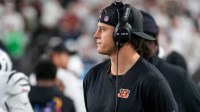 Injured Cincinnati Bengals quarterback Joe Burrow (9) walks the sideline with a headset in the second quarter of the NFL Week 7 game between the Cincinnati Bengals and the Pittsburgh Steelers at Paycor Stadium in downtown Cincinnati on Thursday, Oct. 16, 2025.
