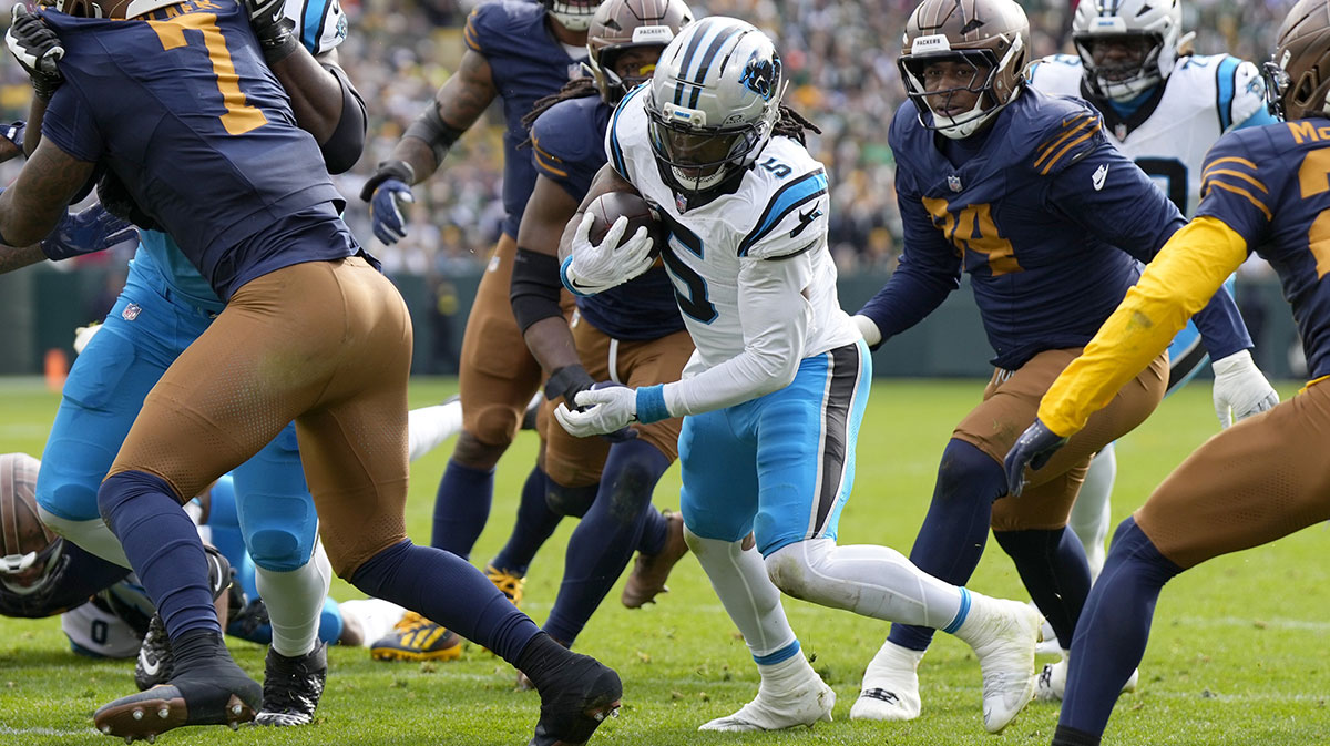 Carolina Panthers running back Rico Dowdle (5) scores a touchdown during the first half against the Green Bay Packers at Lambeau Field.