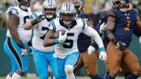 Carolina Panthers running back Rico Dowdle (5) breaks away for a long gain with less than a minute left in the game against the Green Bay Packers during their football game Sunday, November 2, 2025, at Lambeau Field in Green Bay, Wisconsin. Carolina won 16-13.