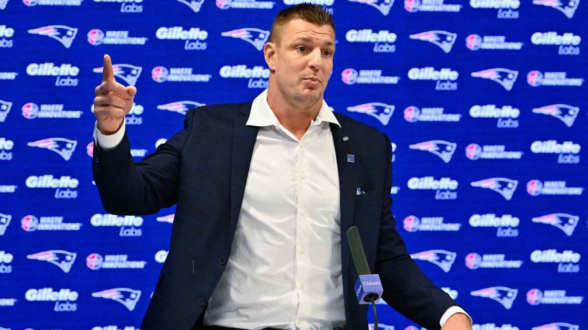 New England Patriots former player and current Fox Sports football analyst Rob Gronkowski speaks during a press conference where he signed a ceremonial one day contract at Gillette Stadium.
